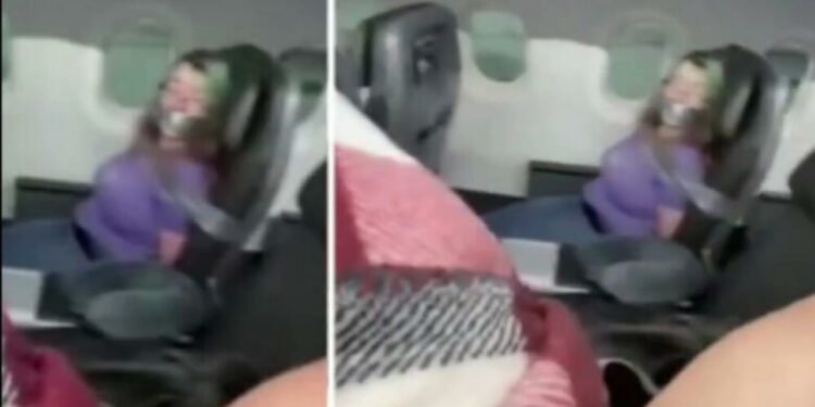 Pasagjerja tenton të hapë derën e aeroplanit, stafi detyrohet ta lidhë tek ulesja